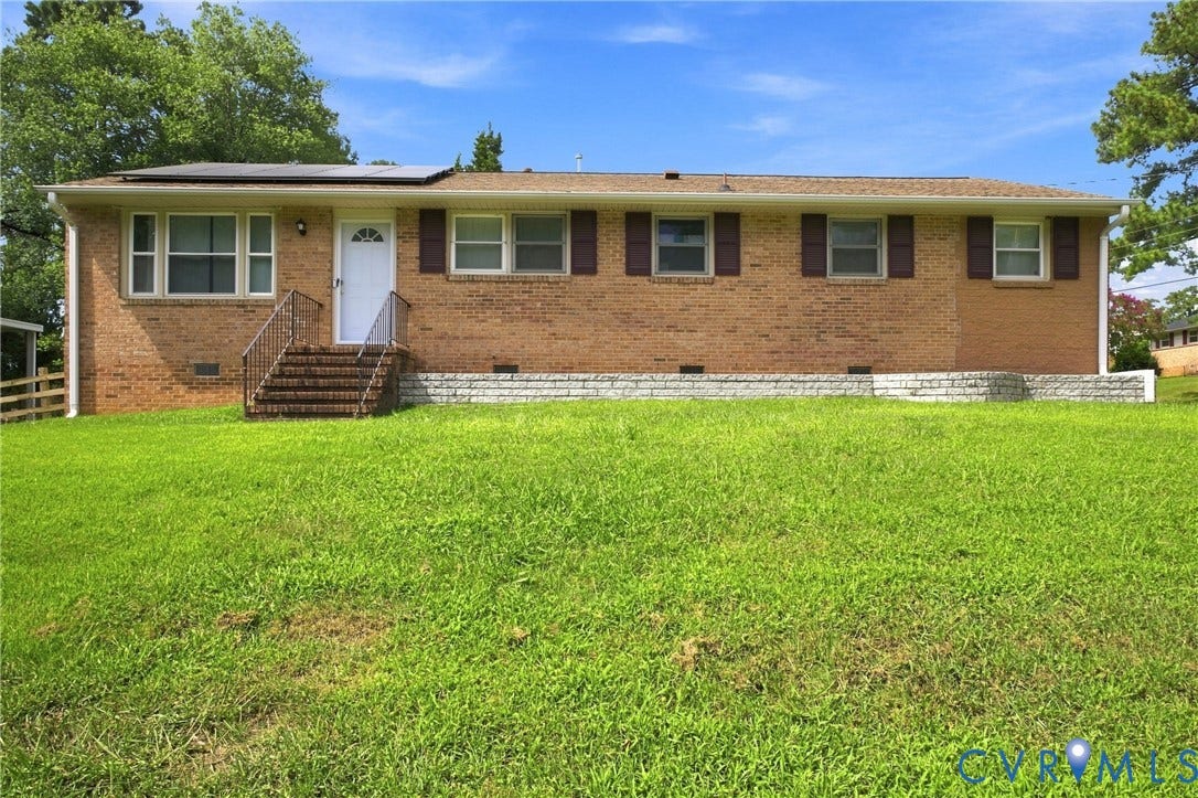 1721 S Halcun Drive, Petersburg, VA 23803 Brick exterior with a white entry door, exterior steps, and metal handrails