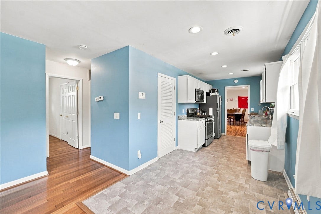 1721 S Halcun Drive, Petersburg, VA 23803 Kitchen with white cabinetry, stainless steel appliances, recessed lighting, and patterned floor tiling