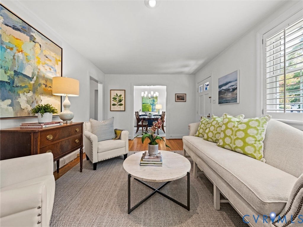 Bright interior space featuring white walls, recessed lighting, and wood-finish flooring visible in the background