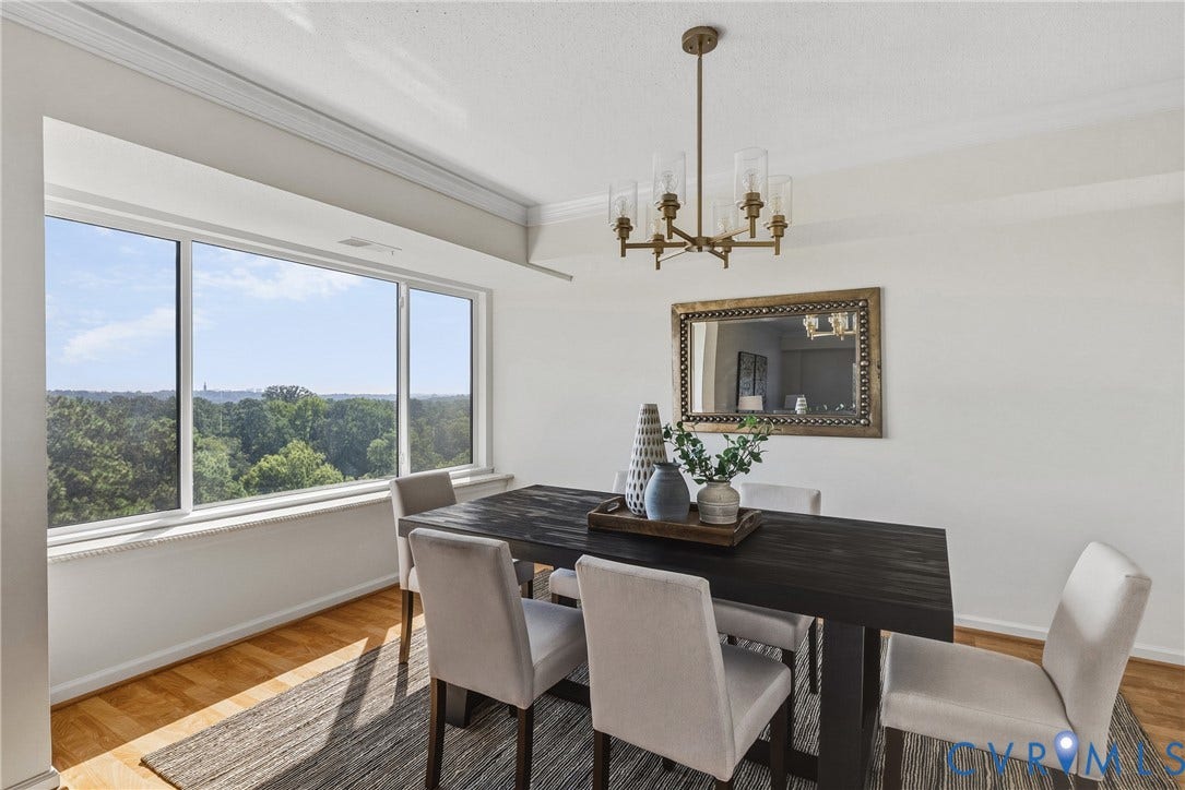 New chandelier, lots of natural light and large windows overlooking mature trees