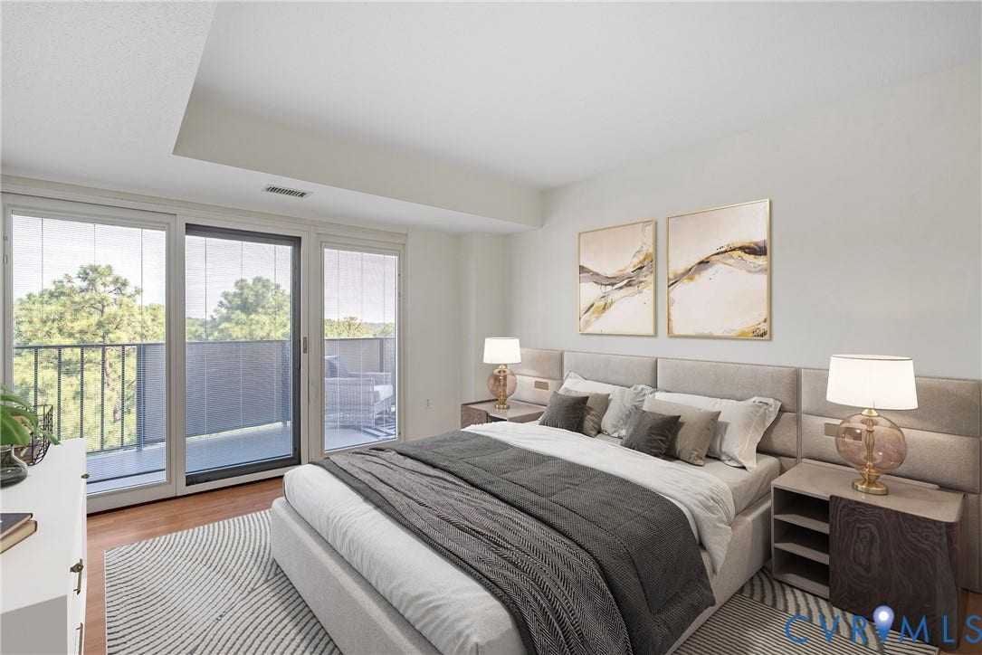 Bedroom 2 with Pella sliding glass doors to the balcony. Virtually staged.