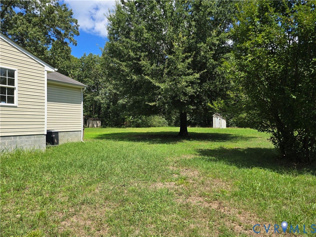 1019 Arizona Drive, Woodhaven, Richmond, VA 23224 Exterior with horizontal siding, a window, and a foundation of concrete blocks