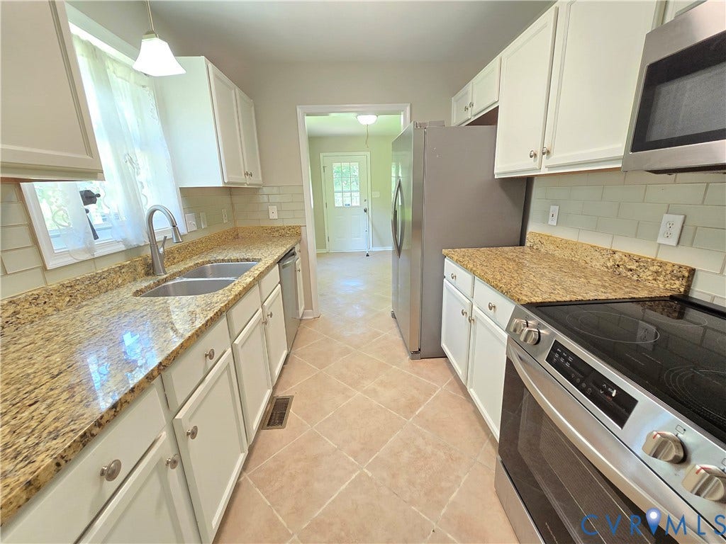 1019 Arizona Drive, Woodhaven, Richmond, VA 23224 Kitchen featuring white cabinetry, granite countertops, a tile backsplash, and tile flooring