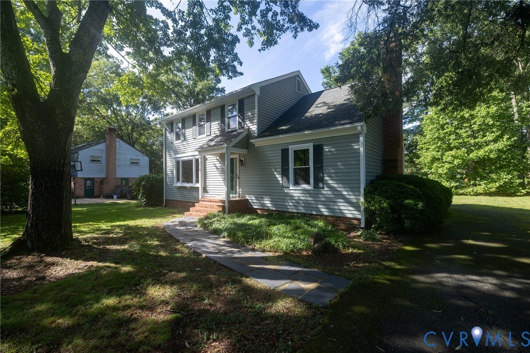 2317 Pleasant Run Drive, Henrico, VA 23238 Two-story exterior with siding, a front entry, a paver walkway, and a paved driveway