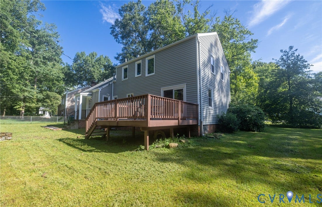 2317 Pleasant Run Drive, Henrico, VA 23238 Expansive green lawn featuring a multi-level wood deck and grey siding exterior