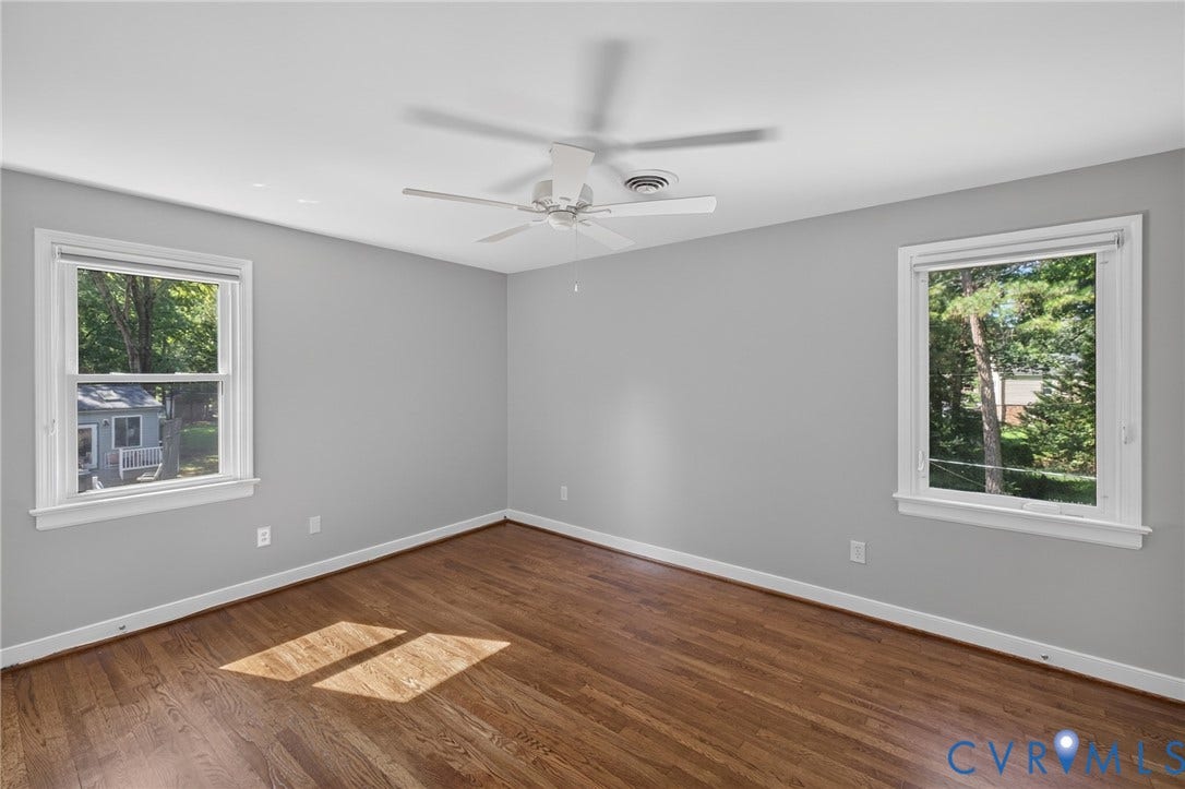 2317 Pleasant Run Drive, Henrico, VA 23238 Hardwood flooring, painted walls, white trim, two windows, and a ceiling fan