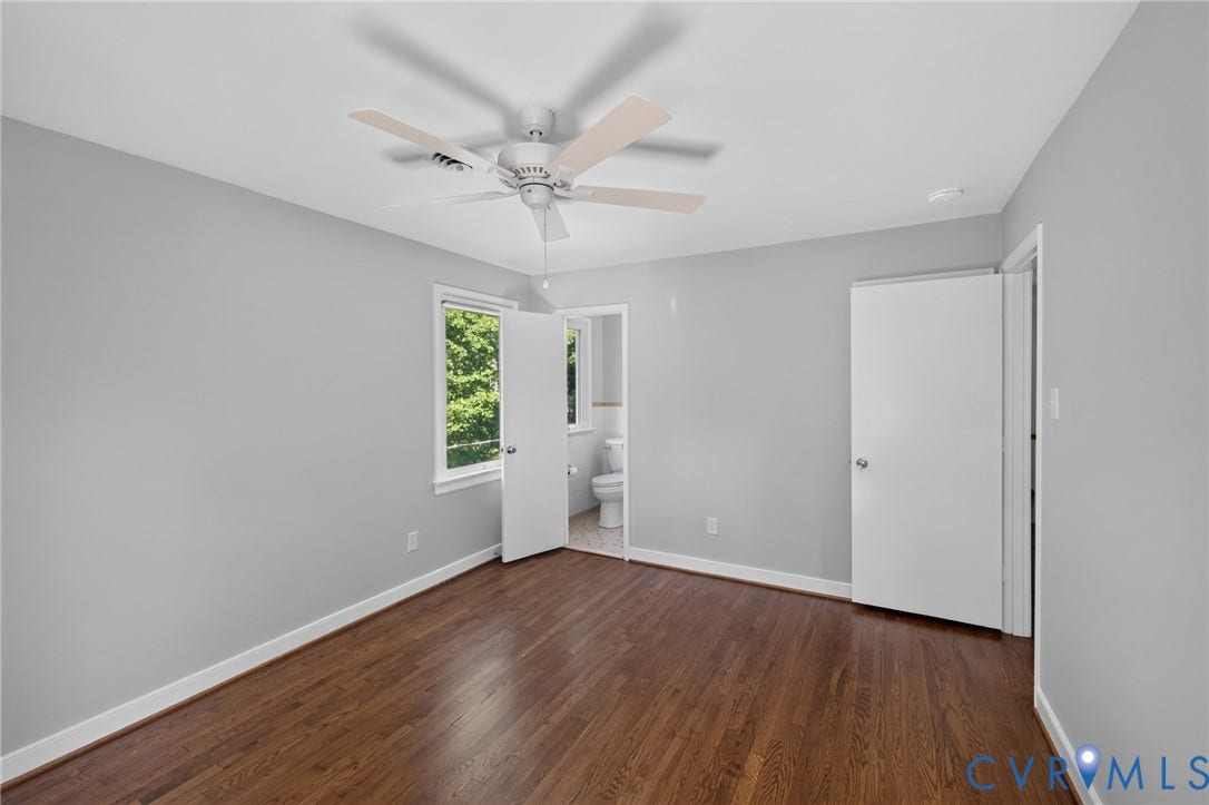 2317 Pleasant Run Drive, Henrico, VA 23238 Wood-finish flooring, white trim, a ceiling fan, and a window providing natural light