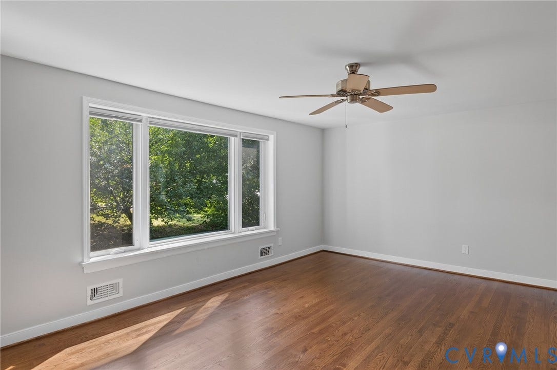 2317 Pleasant Run Drive, Henrico, VA 23238 Hardwood flooring, painted walls, ceiling fan, and a large window