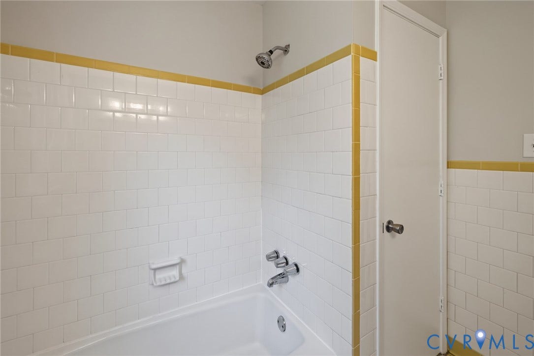 2317 Pleasant Run Drive, Henrico, VA 23238 White subway tile shower surround with yellow accent trim