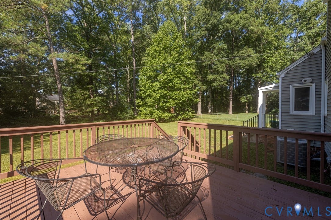 2317 Pleasant Run Drive, Henrico, VA 23238 Wood deck with brown railing and steps to the lawn