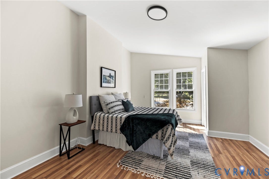 Hardwood-finish flooring, white trim, and light wall tones