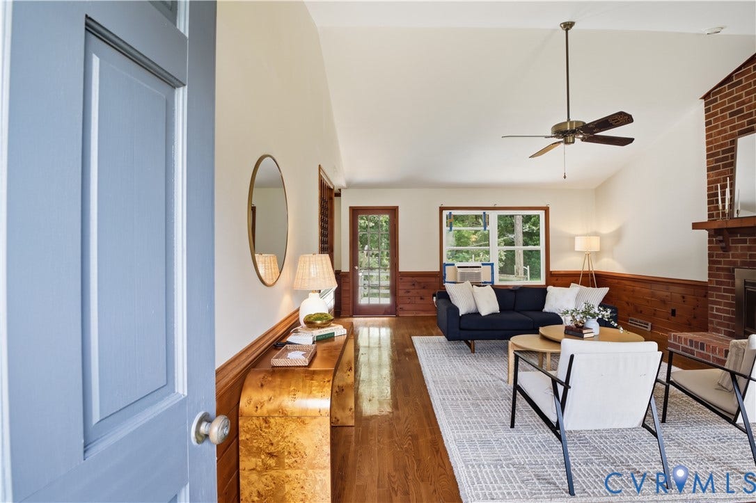 3231 Ludgate Road, Chester, VA 23831 Vaulted ceiling, ceiling fan, wood-finish flooring, half-wall wood paneling, and a brick fireplace