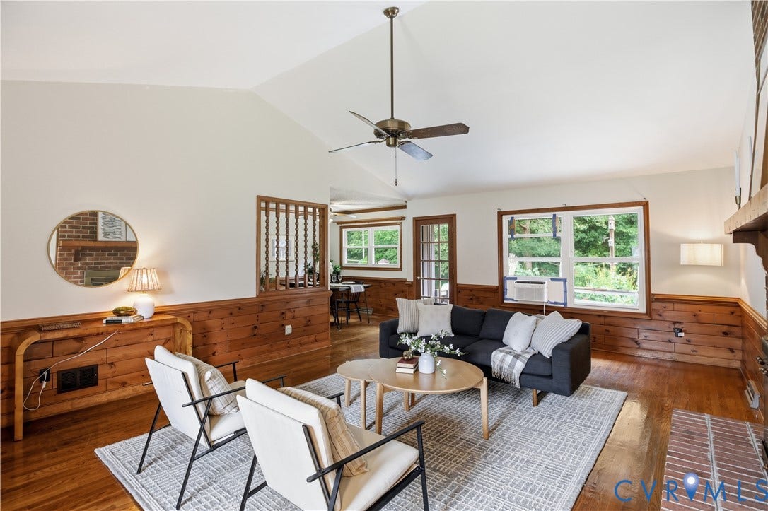3231 Ludgate Road, Chester, VA 23831 Vaulted ceiling, wood-finish flooring, wood paneling, ceiling fan, brick fireplace hearth