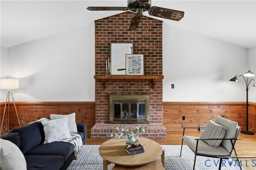 3231 Ludgate Road, Chester, VA 23831 Vaulted ceiling, exposed brick fireplace, wood mantel, wood-paneled walls, ceiling fan