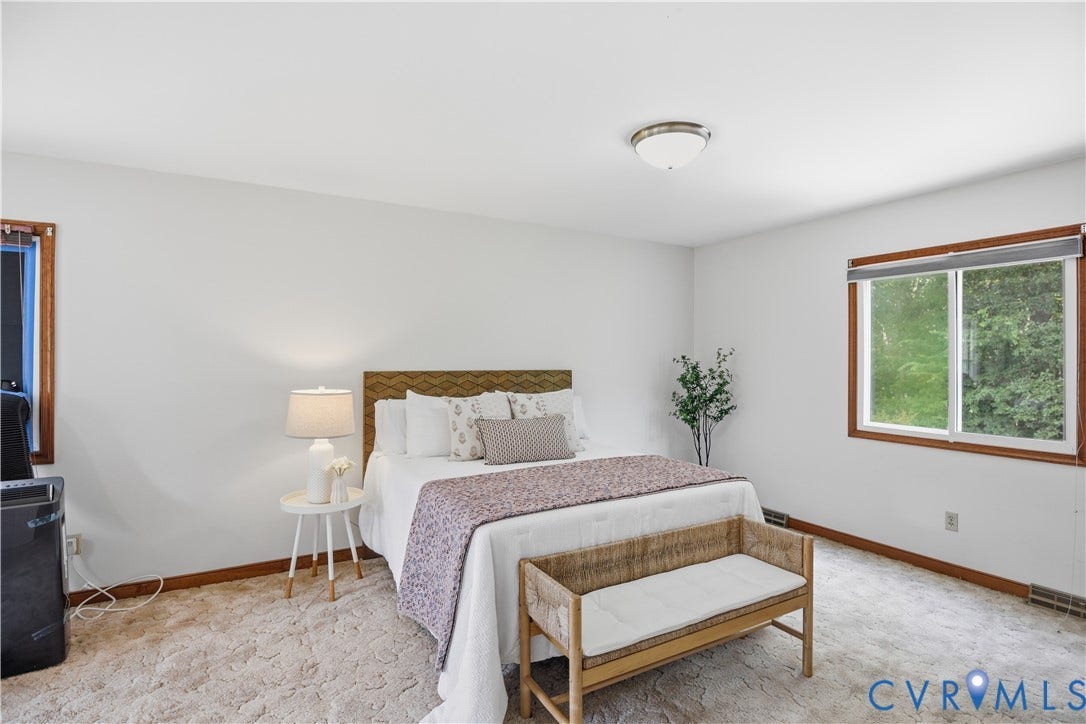 3231 Ludgate Road, Chester, VA 23831 Window with wood-finish trim, neutral wall color, and flush mount ceiling light