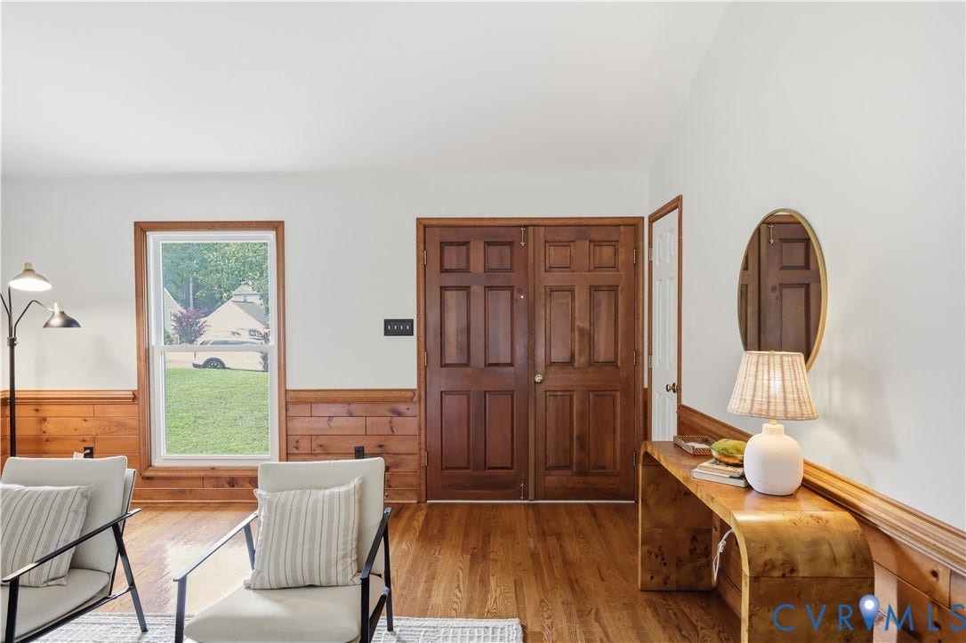 3231 Ludgate Road, Chester, VA 23831 Wood-finish flooring, white walls, and natural wood wainscoting highlight this welcoming entry