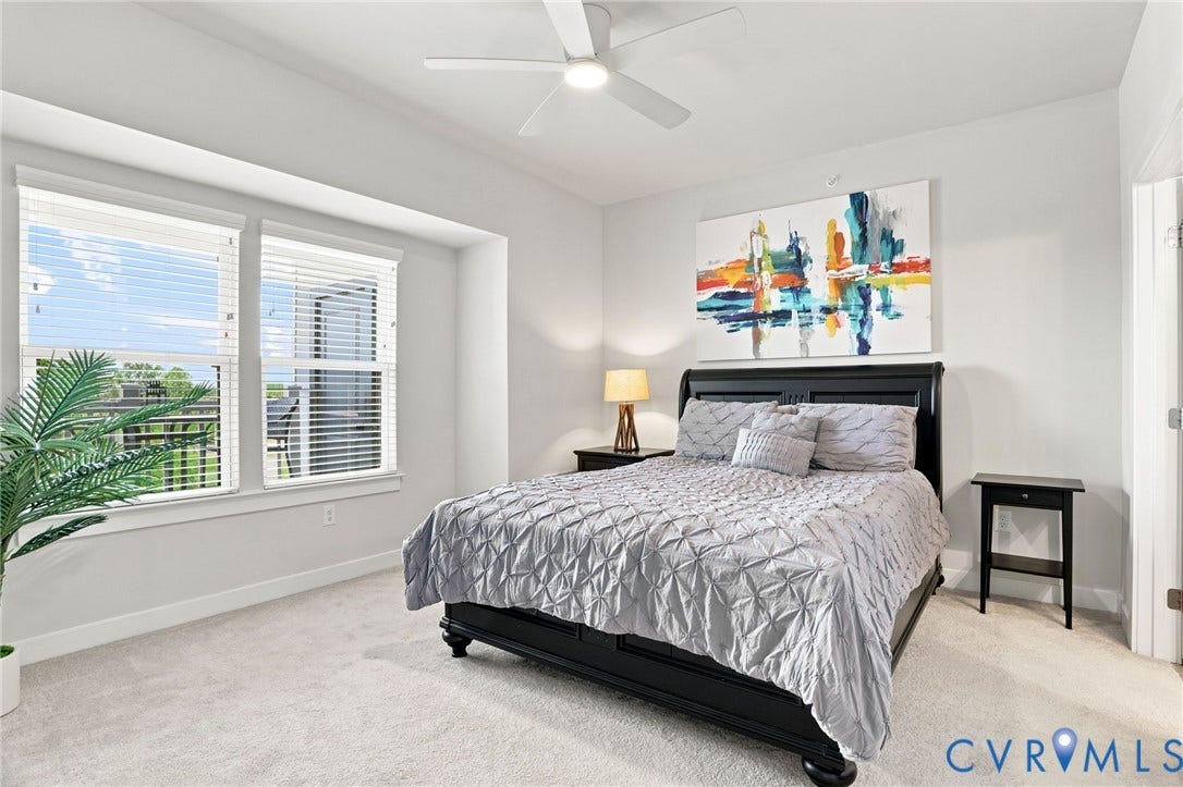 3900 Maze Runner Drive, #403, Midlothian, VA 23112 Oversized windows with custom blinds, light gray wall paint, and a ceiling fan with integrated lighting