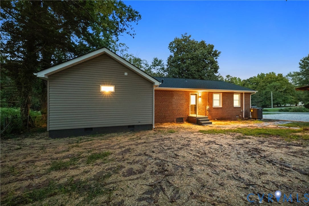 1500 Leicester Road, Cedarhurst - Westover Hills, Richmond, VA 23225 Brick exterior with a detached structure featuring horizontal siding, a gabled roofline, and visible windows