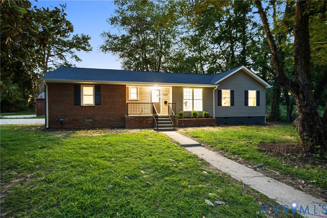 1500 Leicester Road, Cedarhurst - Westover Hills, Richmond, VA 23225 Brick and siding exterior with a covered front porch, concrete walkway, and a sloped roof
