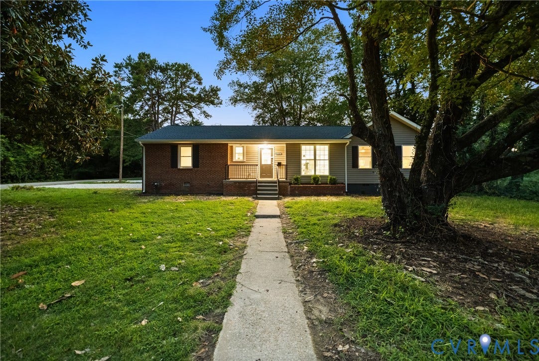 1500 Leicester Road, Cedarhurst - Westover Hills, Richmond, VA 23225 Brick and siding exterior, front porch with railings, established front yard with mature trees, paved walkway, and dark-paneled window shutters