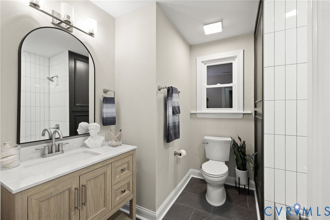 1500 Leicester Road, Cedarhurst - Westover Hills, Richmond, VA 23225 Wood-finish vanity with a white countertop and undermount sink