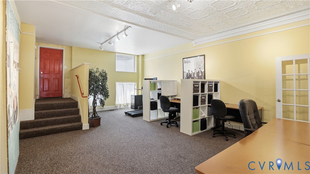 111 N 17th Street, Richmond, VA 23219 Carpeted flooring throughout, track lighting, and a white interior door with glass panels