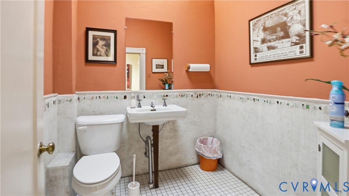 111 N 17th Street, Richmond, VA 23219 Pedestal sink with dual-handle faucet, white toilet, and white tile flooring