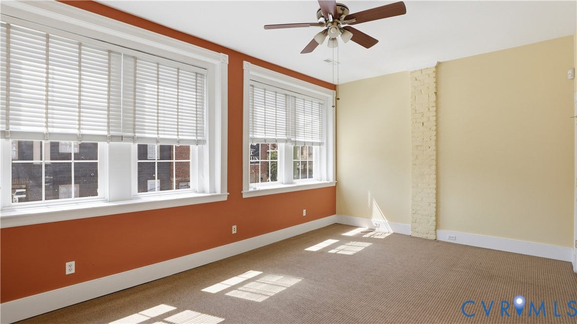 111 N 17th Street, Richmond, VA 23219 Carpeted flooring, white window blinds, ceiling fan, and painted wall finishes