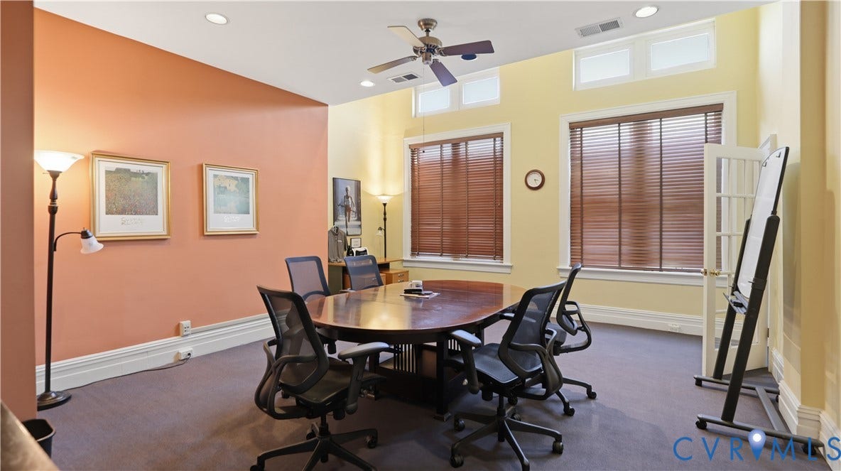 111 N 17th Street, Richmond, VA 23219 Spacious room featuring multiple windows with wood-finish blinds, ceiling fan, recessed lighting, and french doors