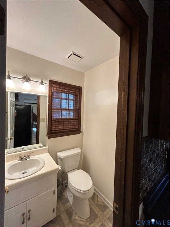 7502 Native Dancer Drive, Chesterfield, VA 23112 Half bath off kitchen/laundry area