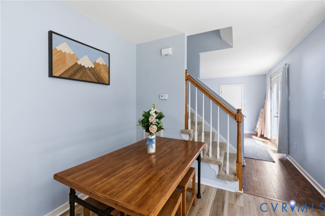 6201 Cameron Bay Terrace, Cameron Bay, Midlothian, VA 23112 Wood-finish flooring, staircase with wood handrail, light blue wall paint, French doors, recessed entry