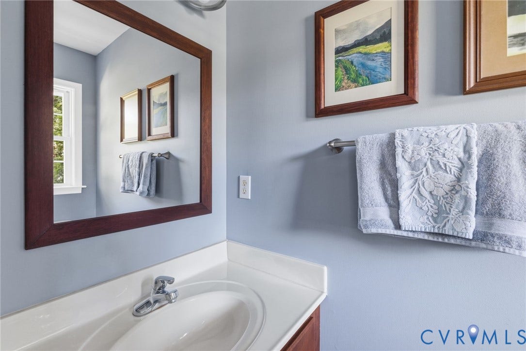 6201 Cameron Bay Terrace, Cameron Bay, Midlothian, VA 23112 Vanity with an integrated sink, polished chrome faucet, and a white countertop