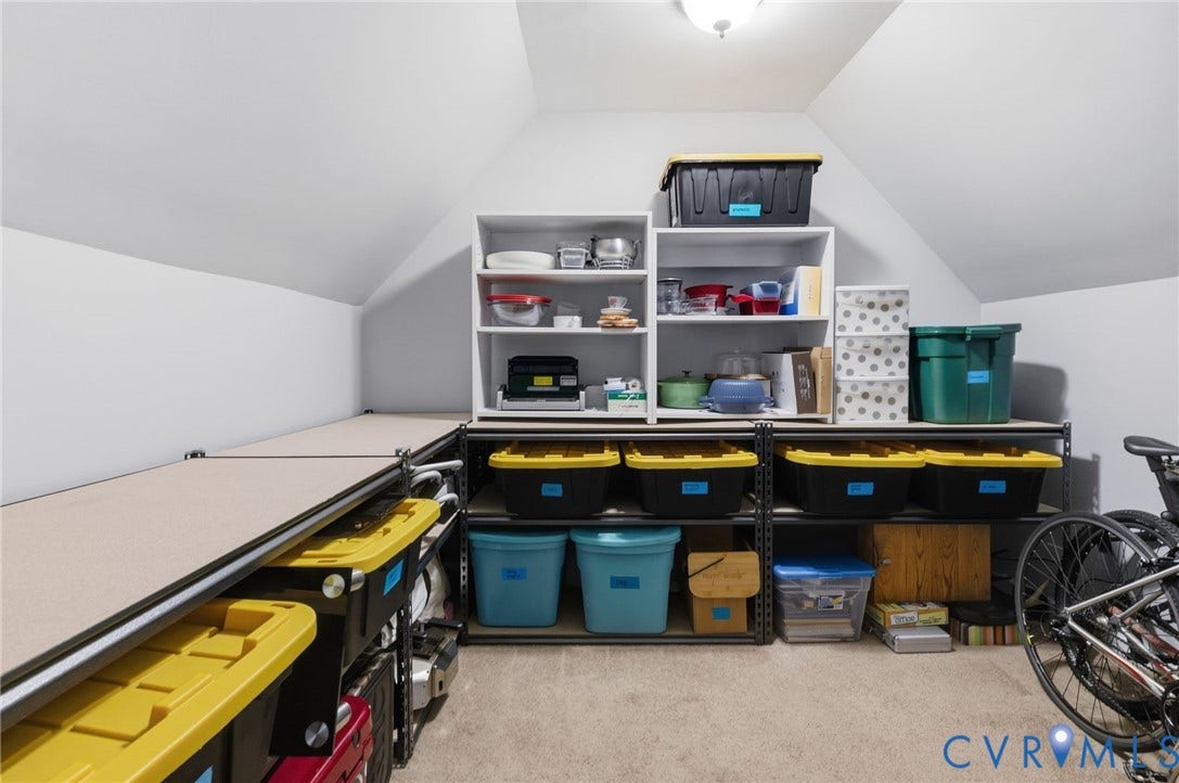 6201 Cameron Bay Terrace, Cameron Bay, Midlothian, VA 23112 Attic storage area featuring sloped ceilings, built-in shelving, and carpeted flooring