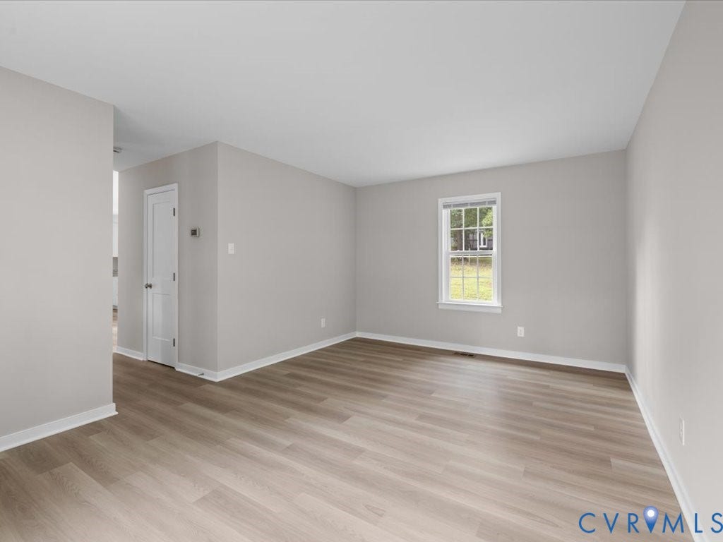3313 New Found Lane, Chester, VA 23831 Light wood-finish flooring, neutral wall tones, and a single window offering natural illumination