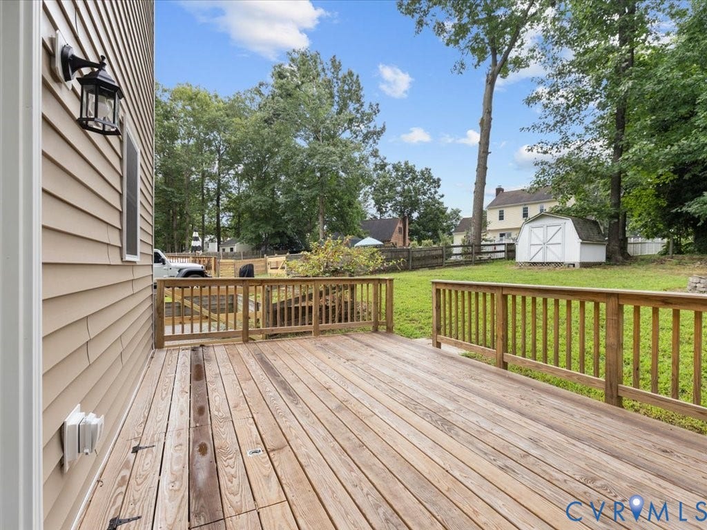3313 New Found Lane, Chester, VA 23831 Expansive wood deck with wood railings, overlooking a grassy yard with mature trees