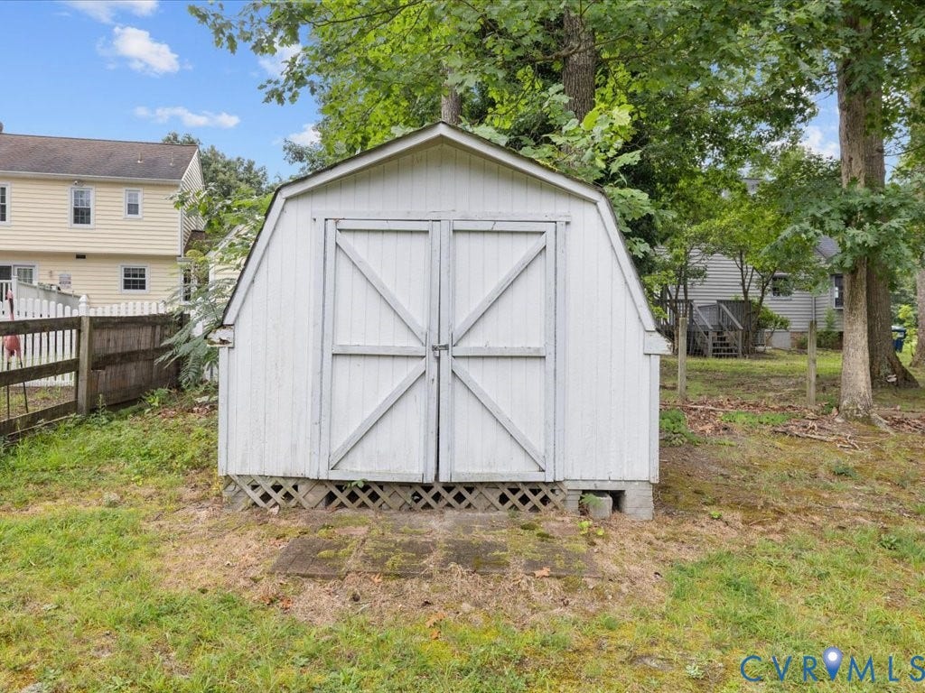 3313 New Found Lane, Chester, VA 23831 White utility shed with double barn-style doors