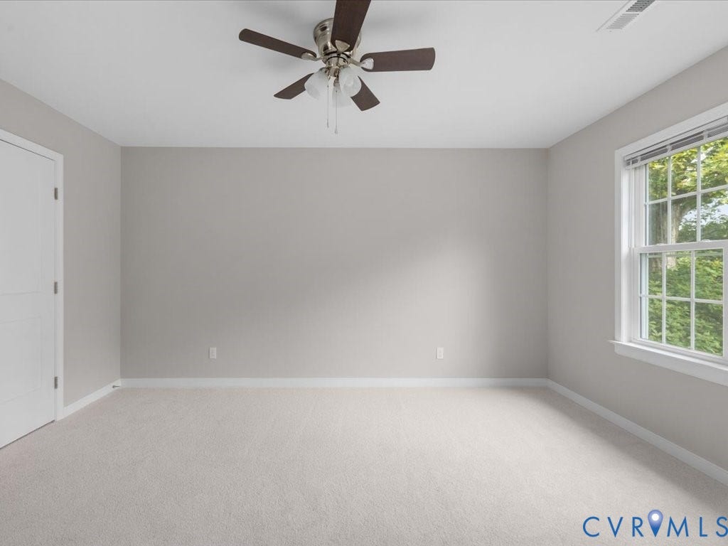 3313 New Found Lane, Chester, VA 23831 Light-toned carpeting, neutral wall paint, and a multi-pane window