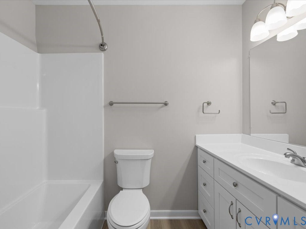 3313 New Found Lane, Chester, VA 23831 White vanity with integrated sink, brushed nickel hardware, and a framed mirror