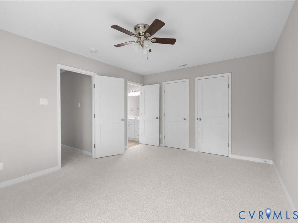 3313 New Found Lane, Chester, VA 23831 Light gray wall paint, carpeting, ceiling fan with light fixture, and multiple panel doors