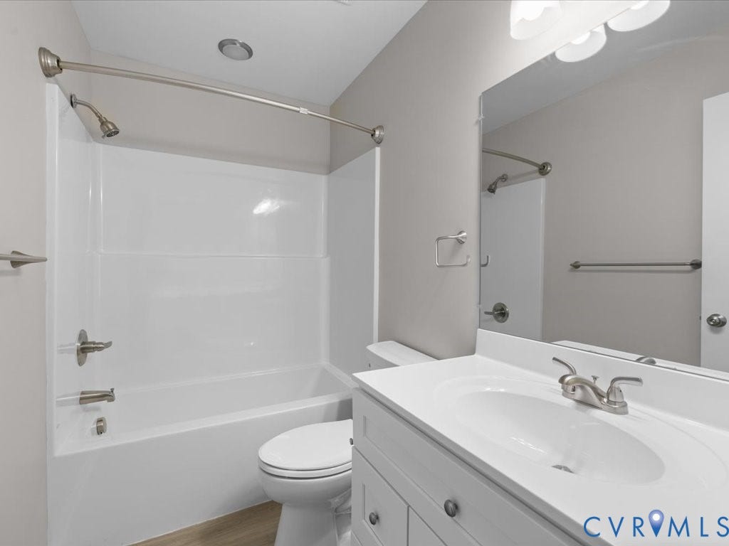 3313 New Found Lane, Chester, VA 23831 White vanity with integrated sink, brushed nickel faucet, and overhead lighting