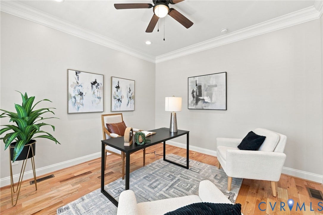 Another view of the spacious office, offering a comfortable and private work-from-home space.