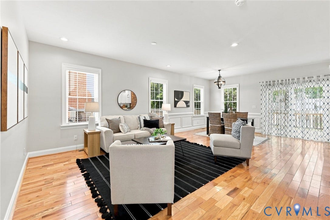 Bright and spacious family room with hardwood floors, recessed lighting, and an open flow into the dining area.
