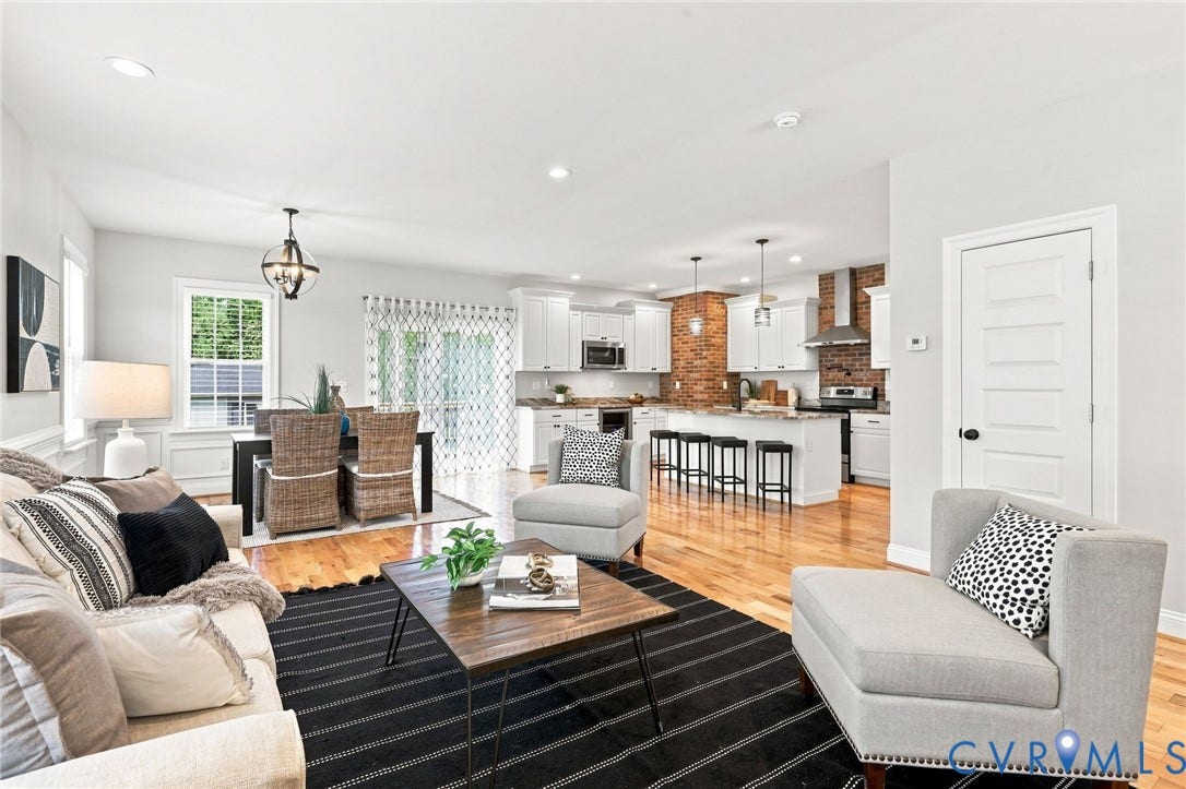 The open floor plan seamlessly connects the family room, dining area, and kitchenperfect for everyday living and entertaining.