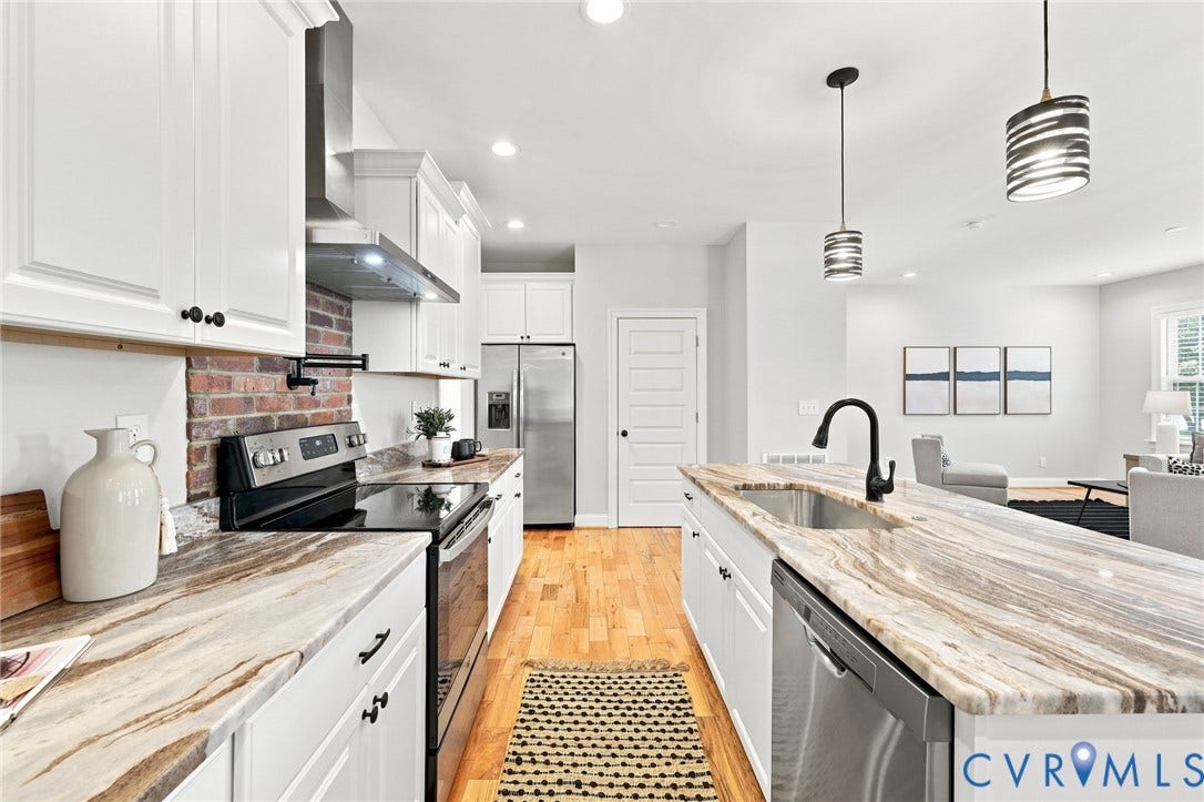 Spacious center island provides additional prep space, seating, and storage while keeping the kitchen open to the main living areas.