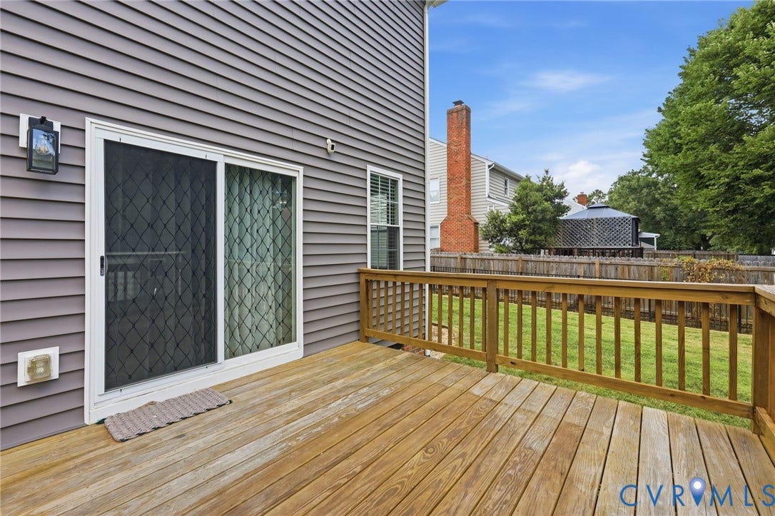 Rear deck provides an easy extension of the living space for outdoor dining, grilling, or relaxing.