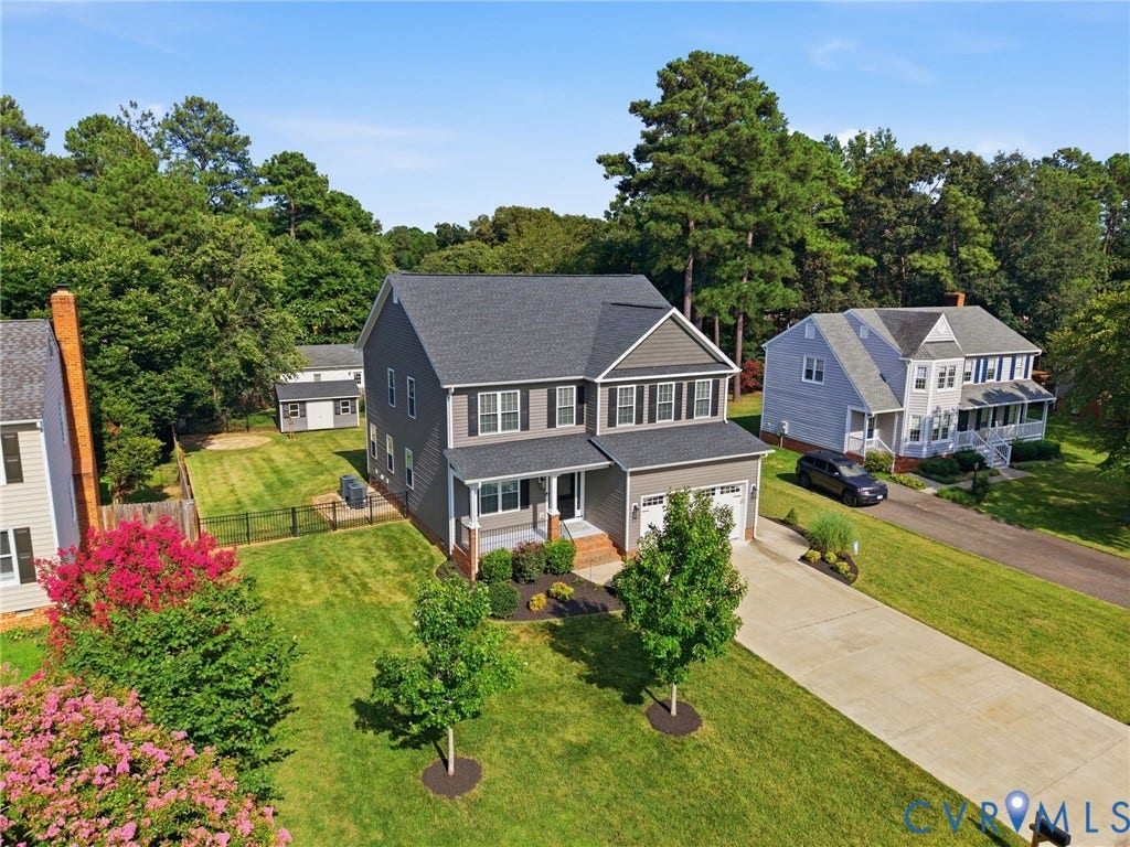Two story Craftsman style home with low maintenance vinyl siding
