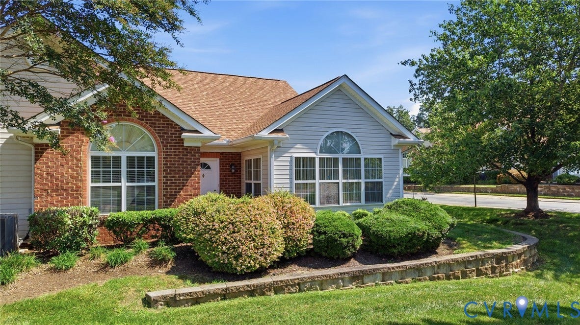 7230 Norwood Pond Court, Midlothian, VA 23112 Brick and siding exterior with arched windows, prominent roofing, and established landscaping