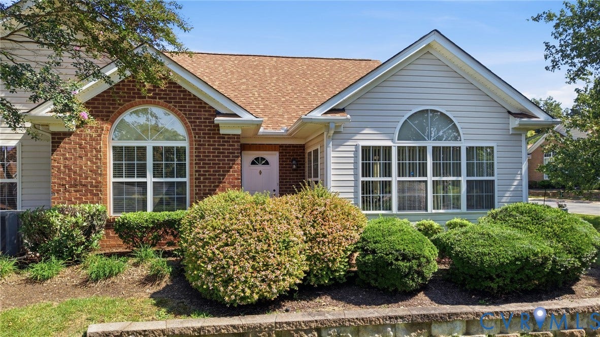 7230 Norwood Pond Court, Midlothian, VA 23112 Brick and siding exterior with arched windows, gabled roofline, and front landscaping