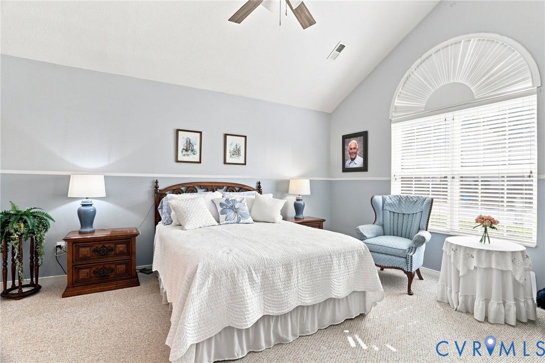7230 Norwood Pond Court, Midlothian, VA 23112 Vaulted ceiling with a ceiling fan, arched window with interior blinds, and wall-to-wall carpeting