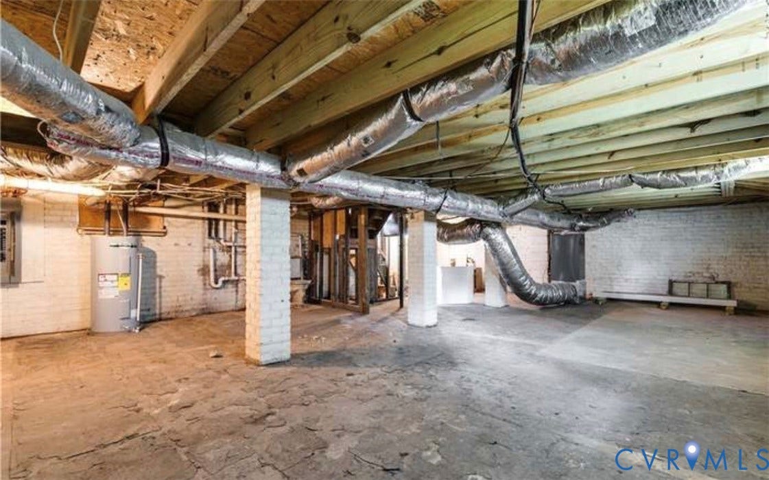 3614 Carolina Avenue, Richmond, VA 23222 Unfinished basement with exposed ceiling joists, concrete flooring, and brick support columns
